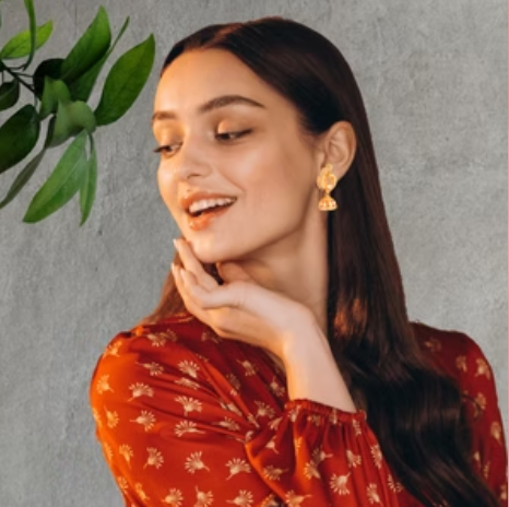 Woman wearing earrings from Bonica's brands