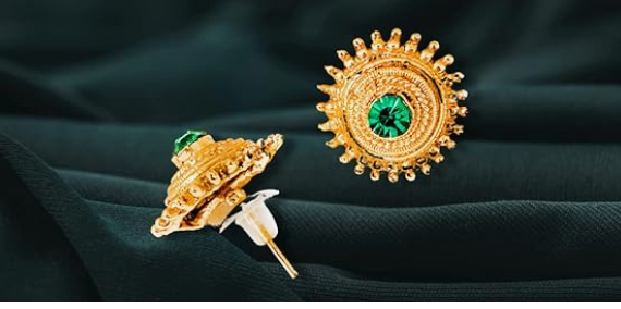 Gold earrings with a green stone